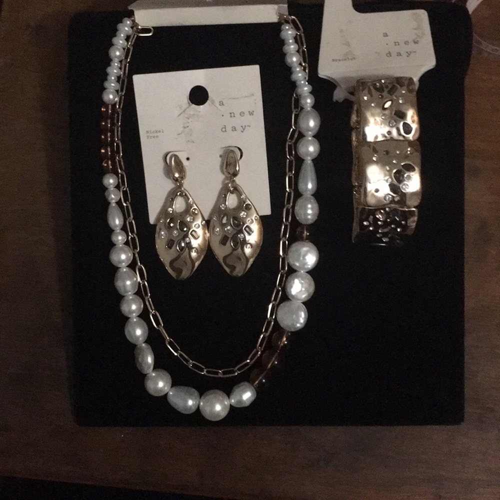 A New Day, 3pc set of gold tone bracelet, necklace, and earrings.